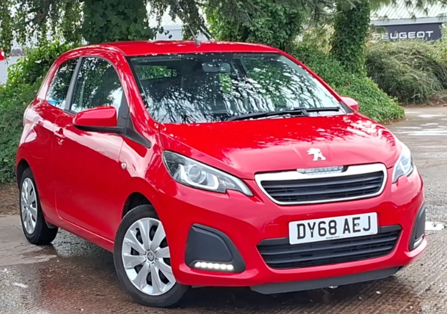 Red Peugeot 108 front three-quarter view