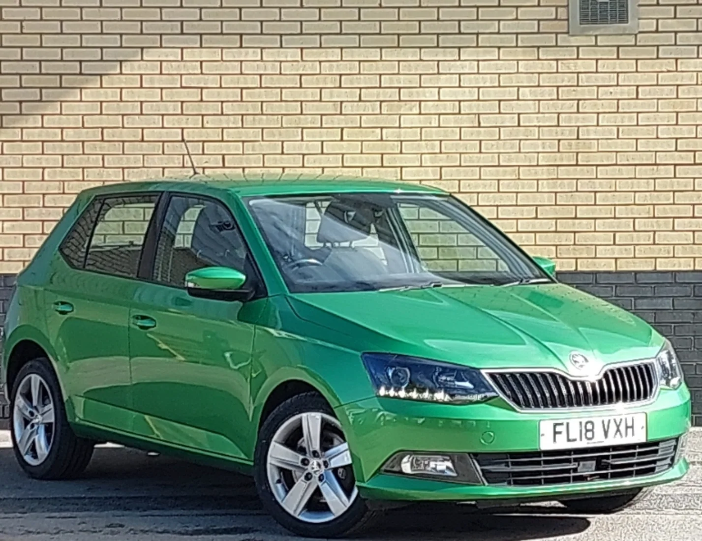 Green Škoda Fabia front three-quarter view